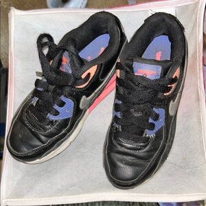 Nike Black and Pink Sneakers with Classic Lace-Up Design